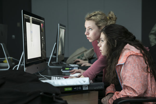 Students learning Photoshop.  Photo by:  Ron Aira/Creative Services/George Mason University